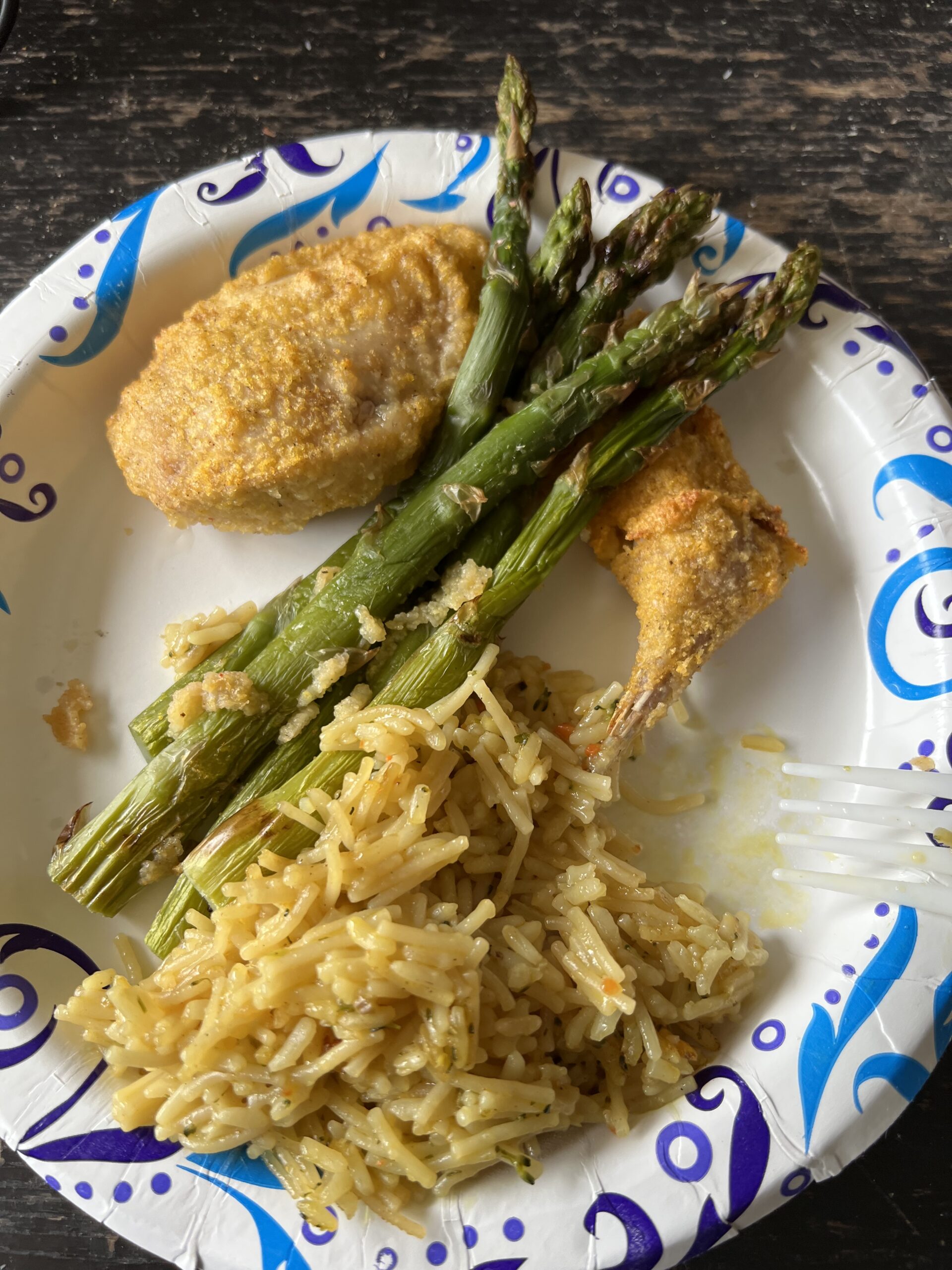 Dinner plate with rice, asparagus and fried chukar partridge