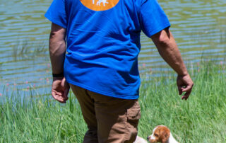 Pictures of French Brittany puppies for sale playing at the lake and catching fish